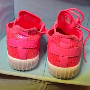 Hot pink, chunky glitter sneakers.